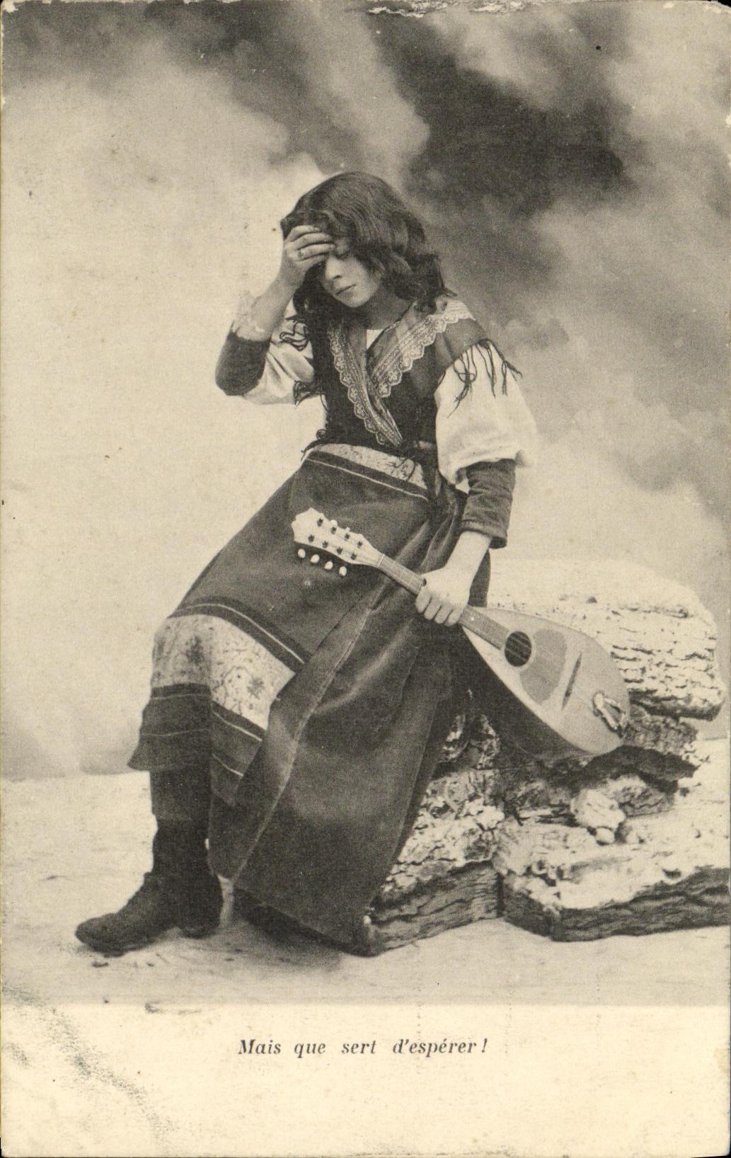 Young woman in traditional costume — with mandolin — publisher unknown