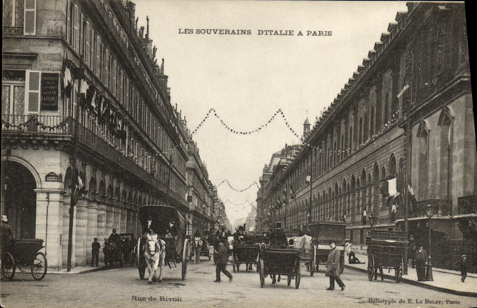 Rue de Rivoli — Les Souverains d'Italie à Paris — Héliotypie de E. Le Delet, Paris