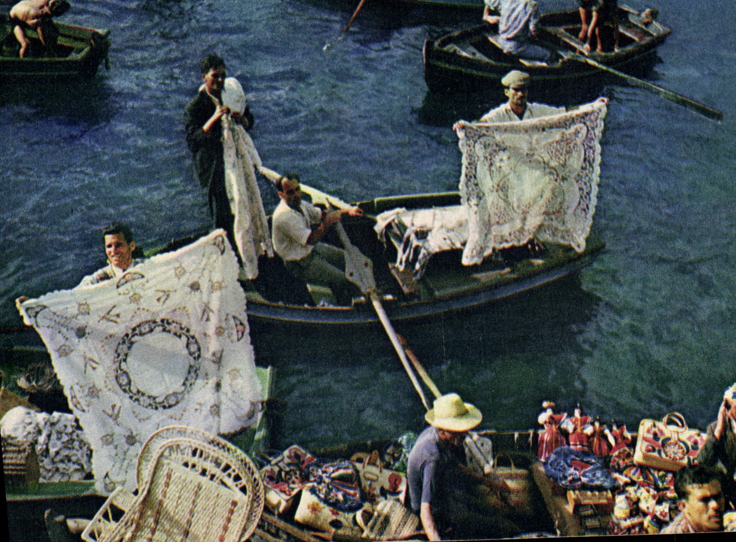 CPM hand Made Embroidery and Fancy Goods Being sold alongside steamer in Funchal Bay Madeira