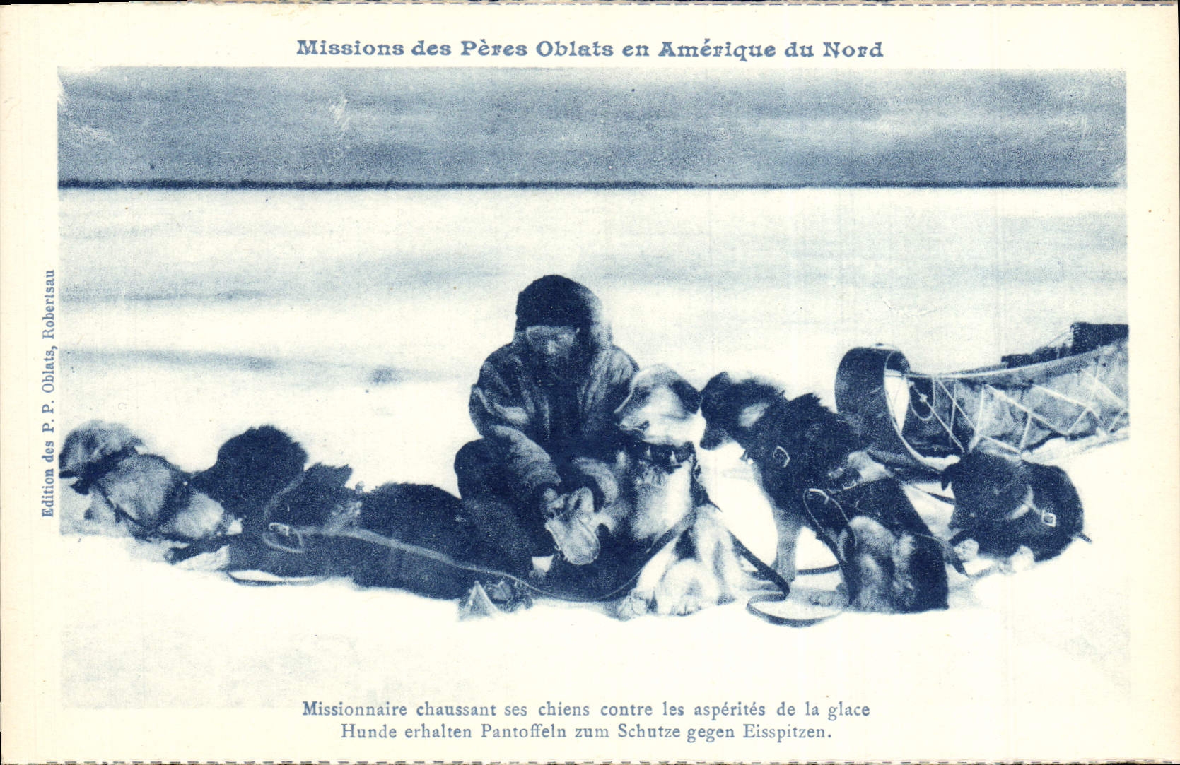 Missionnaire chaussant ses chiens contre les aspérités de la glace — Missions des Pères Oblats en Amérique du Nord — Édition des P. Oblats, Robertisau