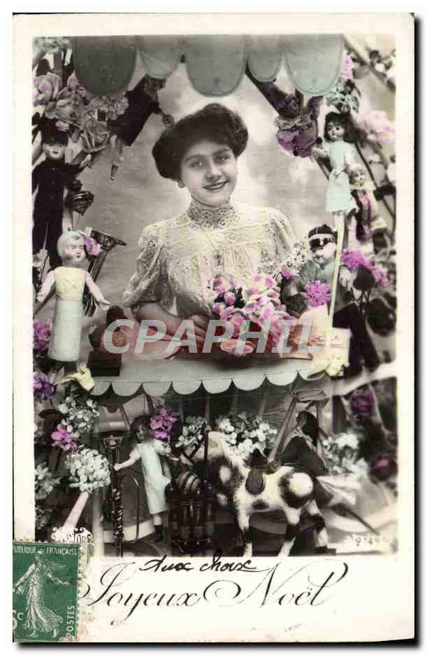 Femme souriante entourée de poupées et jouets — Joyeux Noël — éditeur inconnu, n° de série non visible