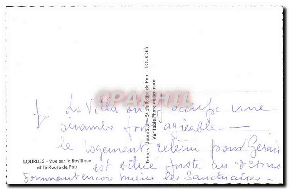 CPM Lourdes Vue sur la basilique et la route de Pau  — Verso