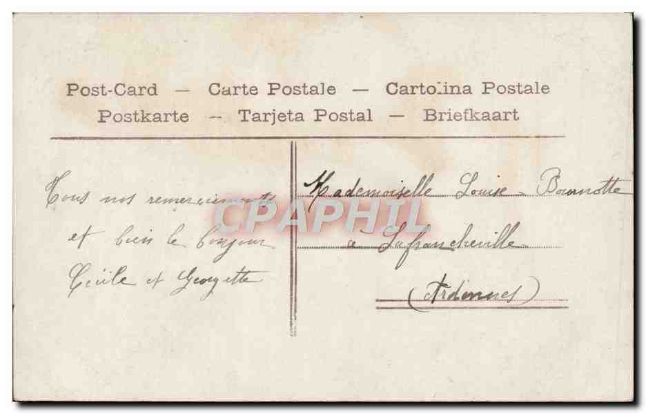 Femme en robe à motifs et chapeau fleuri — Un Baiser — Aéro, n°539 — Verso