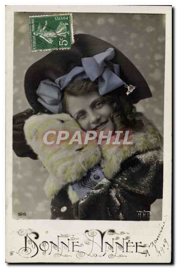 Jeune femme en manteau fourré — neige — H.K.C. n° 5216 — timbre 5c vert