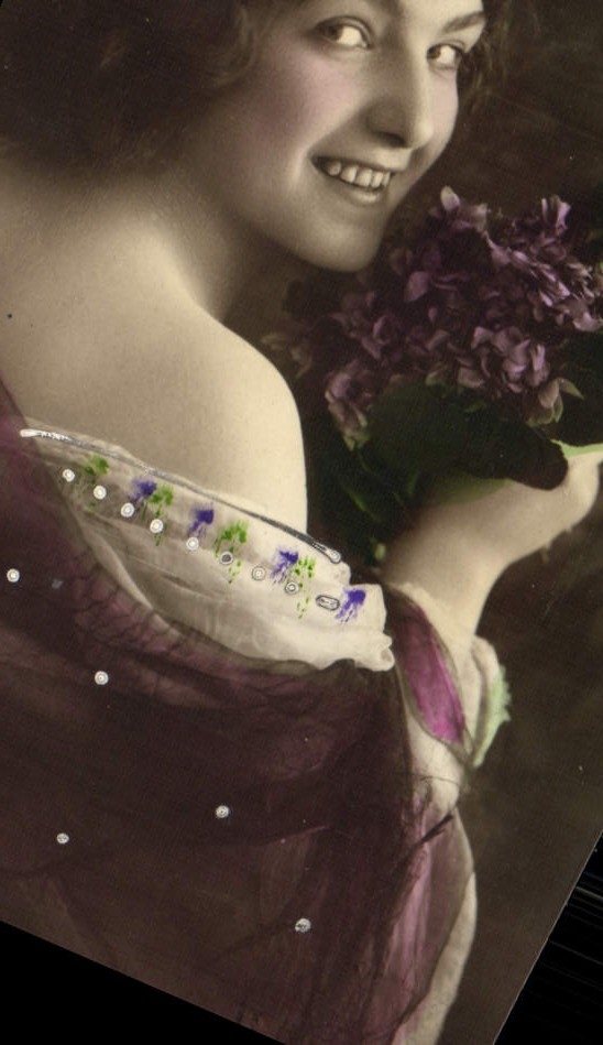 Smiling Young Woman Holding a Bouquet of Lilacs — Unidentified Publisher