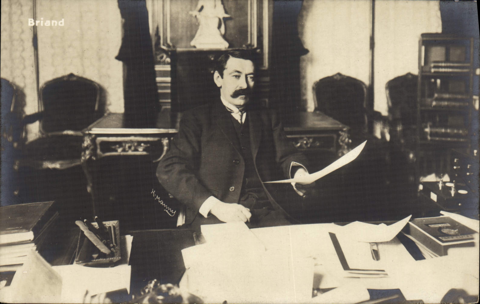 René Briand — in his office — publisher H. Mannaud