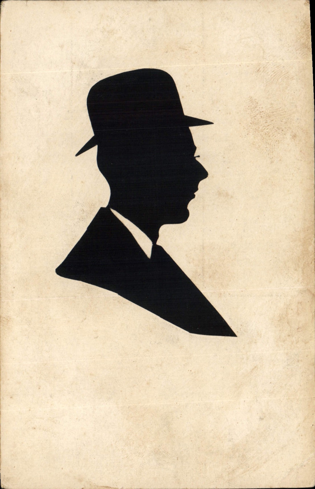 Silueta de un hombre con traje y sombrero — editor desconocido, número de serie no visible
