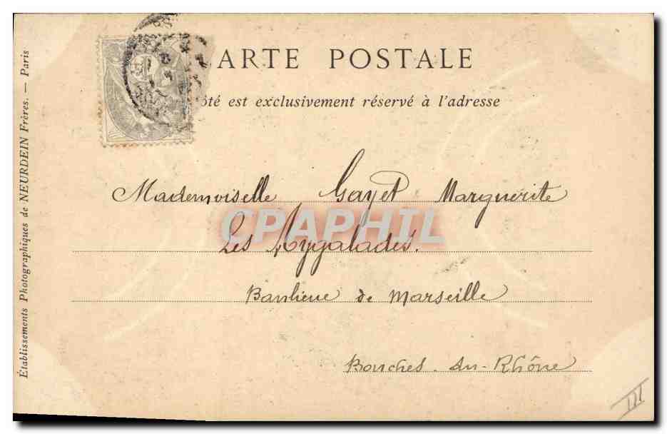 Enfant en tenue orientale jouant d'un instrument — Collection COUESNON & Cie, Rue d'Angoulême, Paris — Verso