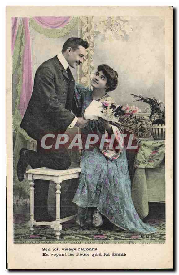Un homme offrant des fleurs à une femme — B.L.D. — n°3127