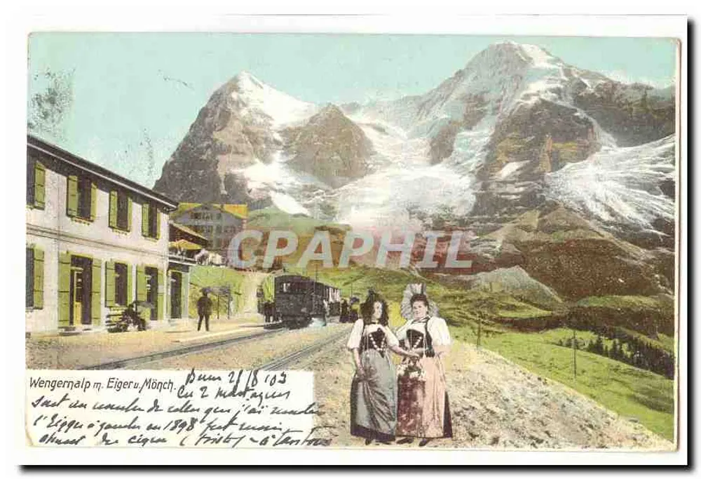 Wengernalp m. Eiger u. Mönch — Vista das montanhas com duas mulheres em traje local - Frente