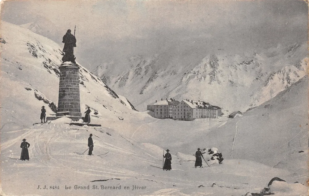 Der Große St. Bernard im Winter — Monument und schneebedeckte Gebäude, Verlag J.J. 8484 - Vorderseite