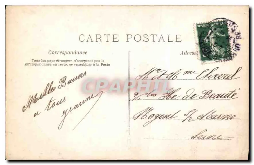 Mulher com vestido de bolinhas segurando flores — H. Nannu, Paris, n° 921 - Verso