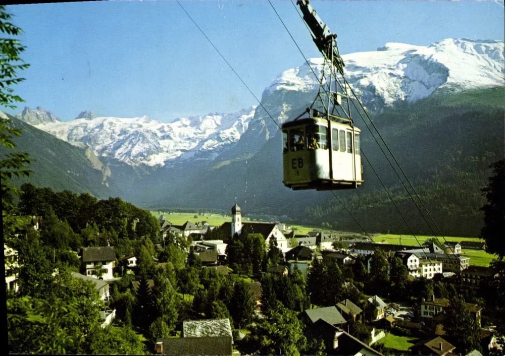 Engelberg — Aussicht mit Seilbahn und schneebedeckten Bergen — Rud Suter AG, n° 19060 - Vorderseite