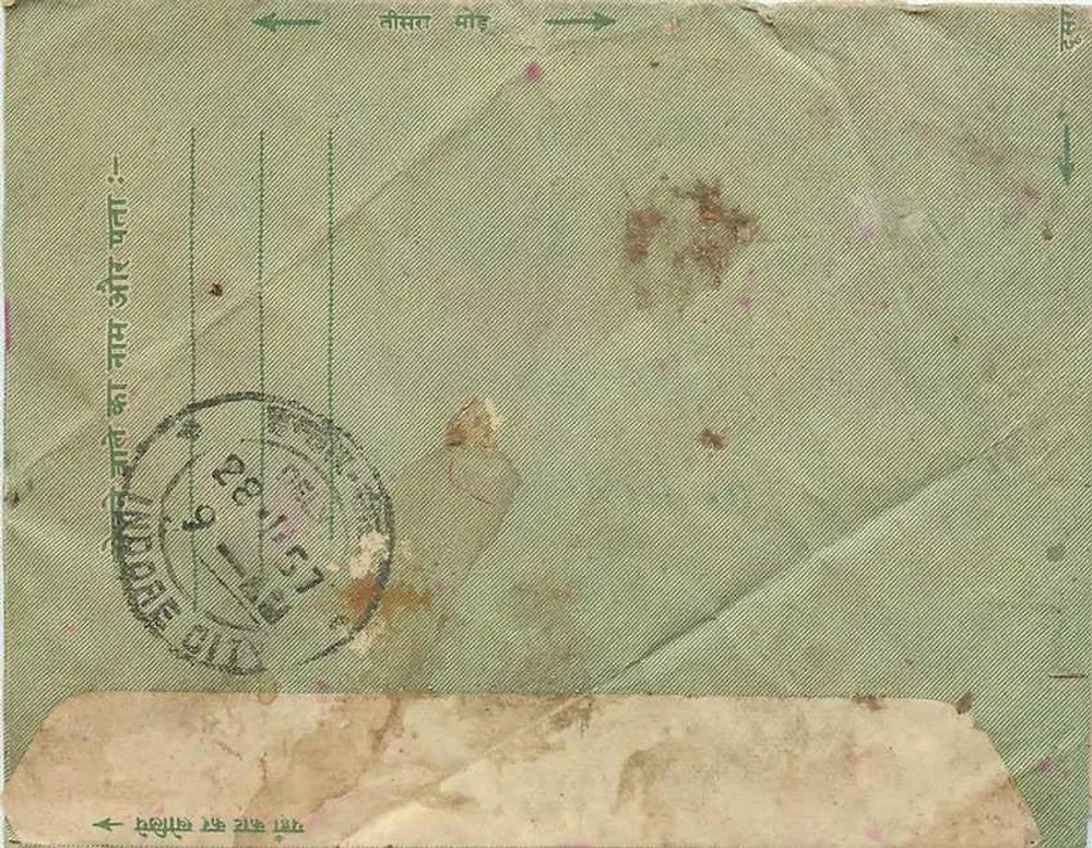 Carta postal indiana — texto em devanagari — selo de 1½ anna — carimbo 'Rajasthan' — datada 28.4.57 - Verso