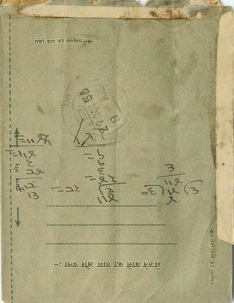 Carta postal indiana — texto em devanagari — selo de 1½ anna — destinatário em Kuchaman, Rajasthan - Verso