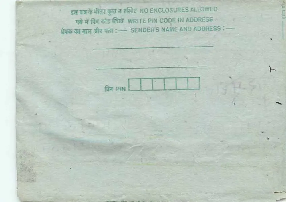 Carta postal indiana — selo verde, carimbo postal — destinatário em Orai, Uttar Pradesh - Verso