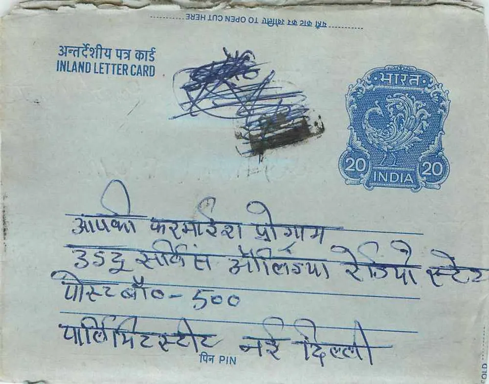 Carta postal interna indiana — selo de 20 annas azul, texto em hindi e inglês — destinatário Khalil Ahmed B.P.M. em Delhi - Frente