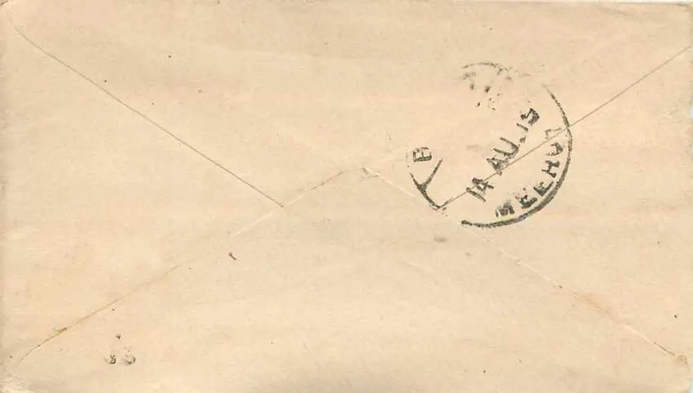Carta postal enviada de Meerut — texto em escrita devanagari e em inglês — selo verde 'HALF ANNA' e carimbo postal - Verso