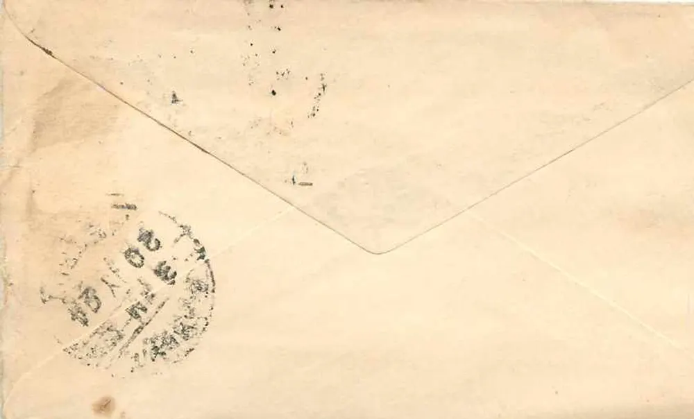 Carta postal indiana — texto em escrita devanagari — destinatário em Baraut (Meerut) — selos e carimbos postais - Verso