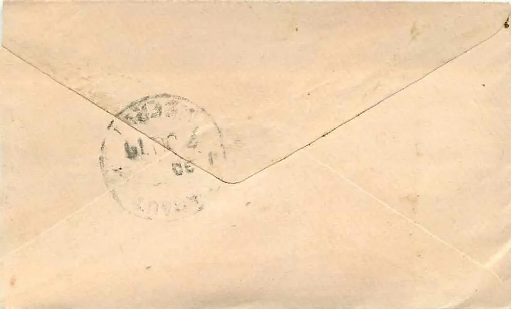 Carta postal enviada de Meerut — texto em escrita devanagari e endereço manuscrito — selo e carimbo postal indiano - Verso
