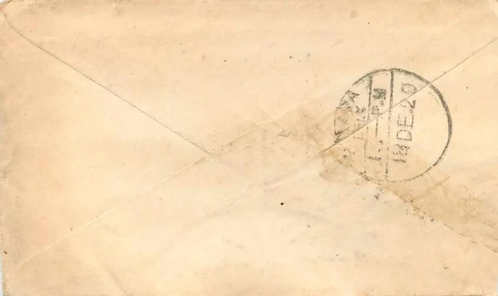 Carta postal da Índia — endereço para Pirawana — selo e carimbo da Índia - Verso