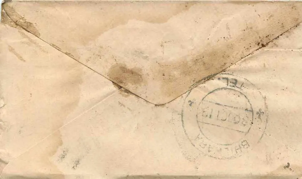 Carta postal de Gwalior — texto em escrita devanagari — selo Half Anna e carimbo de Gwalior - Verso