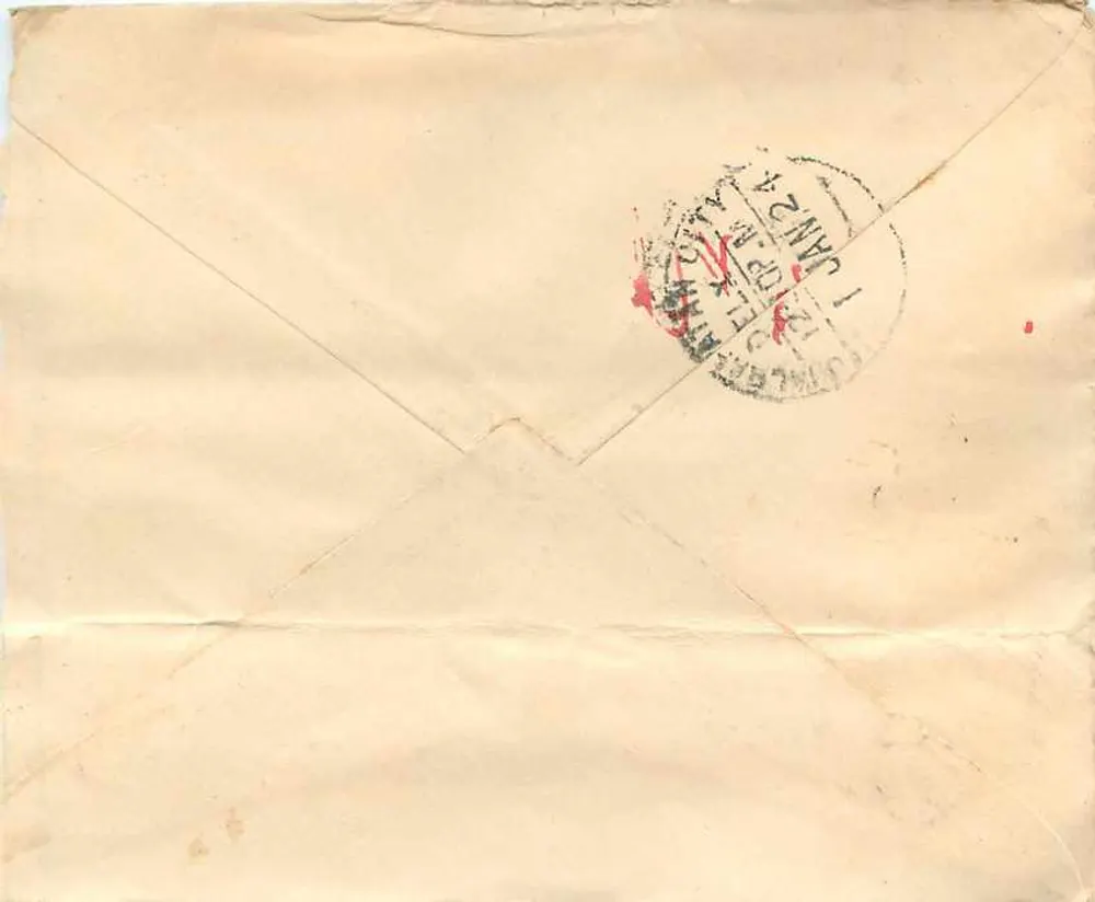 Carta postal indiana — texto em escrita devanagari — selo de 1 anna e carimbo postal - Verso