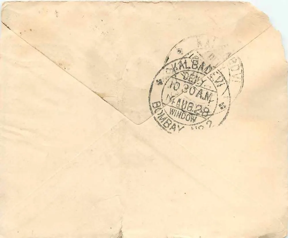 Bombay. Kalbadevi — carta para Bombay, Pancobra — carimbo de 1 anna, carimbo postal Bombay Kalbadevi 14 de agosto de 1928 - Verso