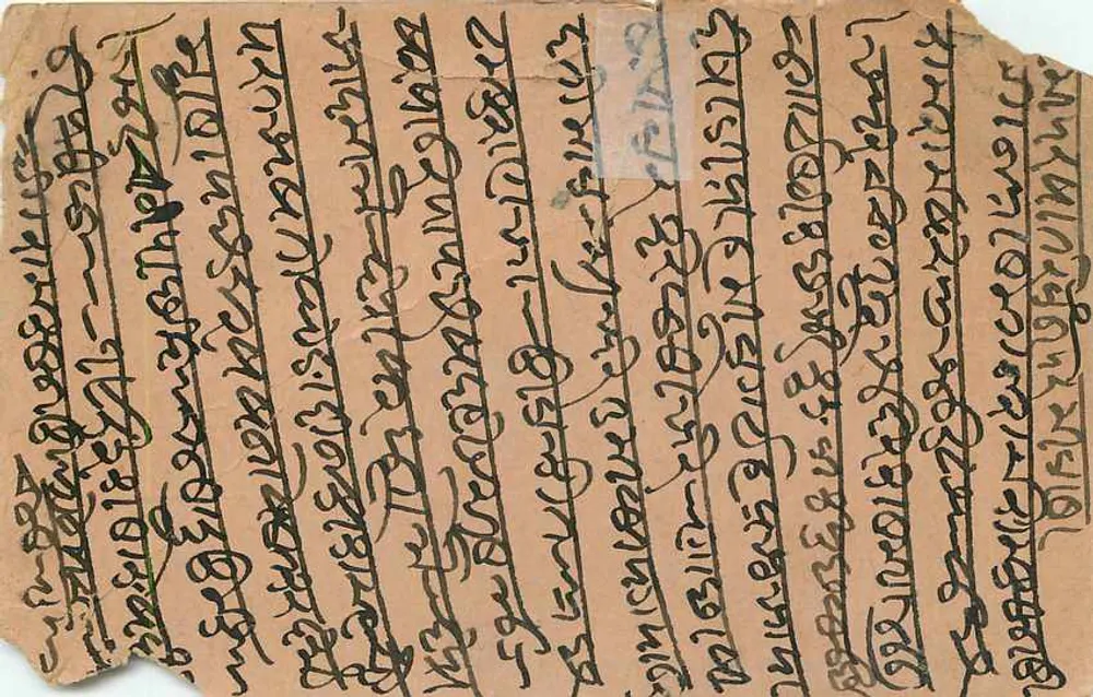 Durga assise sur un rocher avec un paon — illustration imprimée — éditeur : 'मुंबई खाते कमीशन एजेंट' (Mumbai Khate Kamishan Agent) - Verso