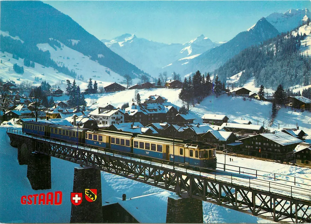 Gstaad — vista invernal com trem sobre viaduto — Verlag Photoglob AG Zürich - Frente