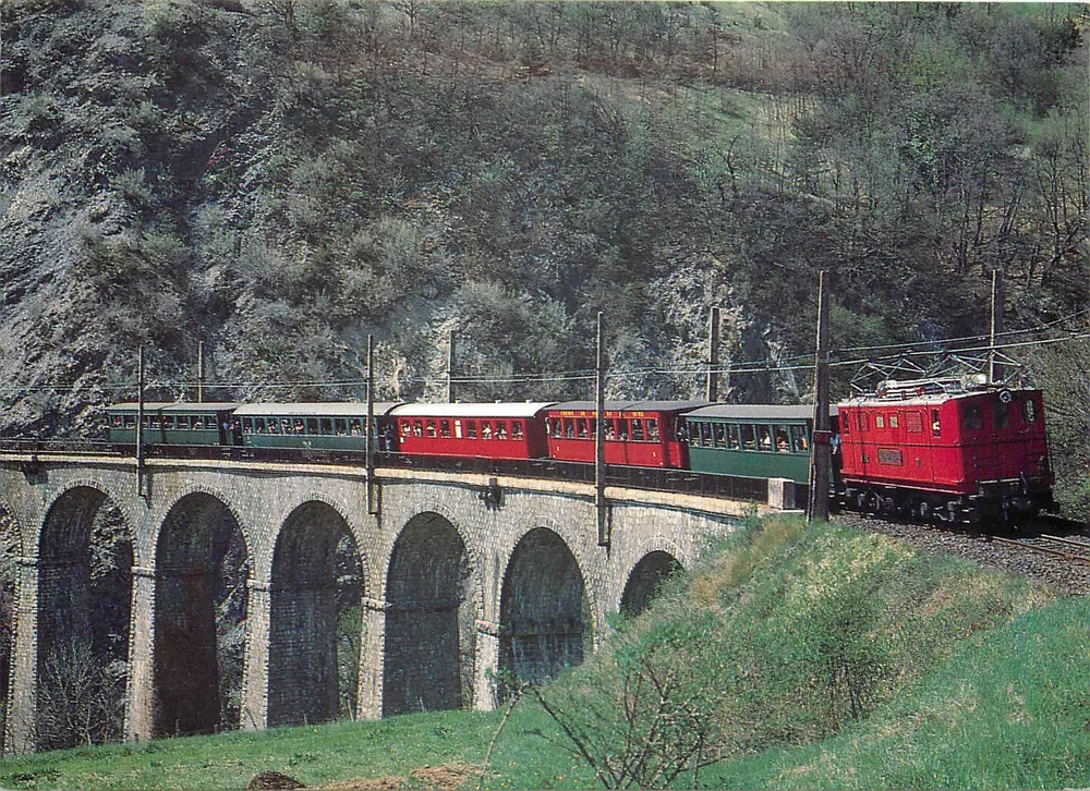 Zug auf dem Viadukt des Bachs Vaulx — Eisenbahn La Mure — Druckerei Ponsel 1988 (5/87) - Vorderseite