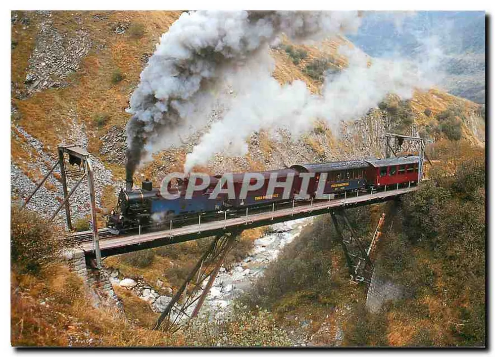 Pociąg parowy na viaducie Steffenbach — Dampf-Zahnradlokomotive HG 3/4 Nr. 2 «Gletschhorn» — wydawca REIJU Color Karte - Awers