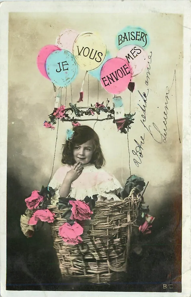 Fille dans un panier de roses — avec ballons — éditeur B.C. - Recto