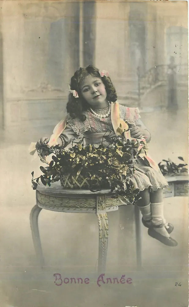 Girl sitting with a flower basket — Happy New Year 24 — unknown publisher - Front