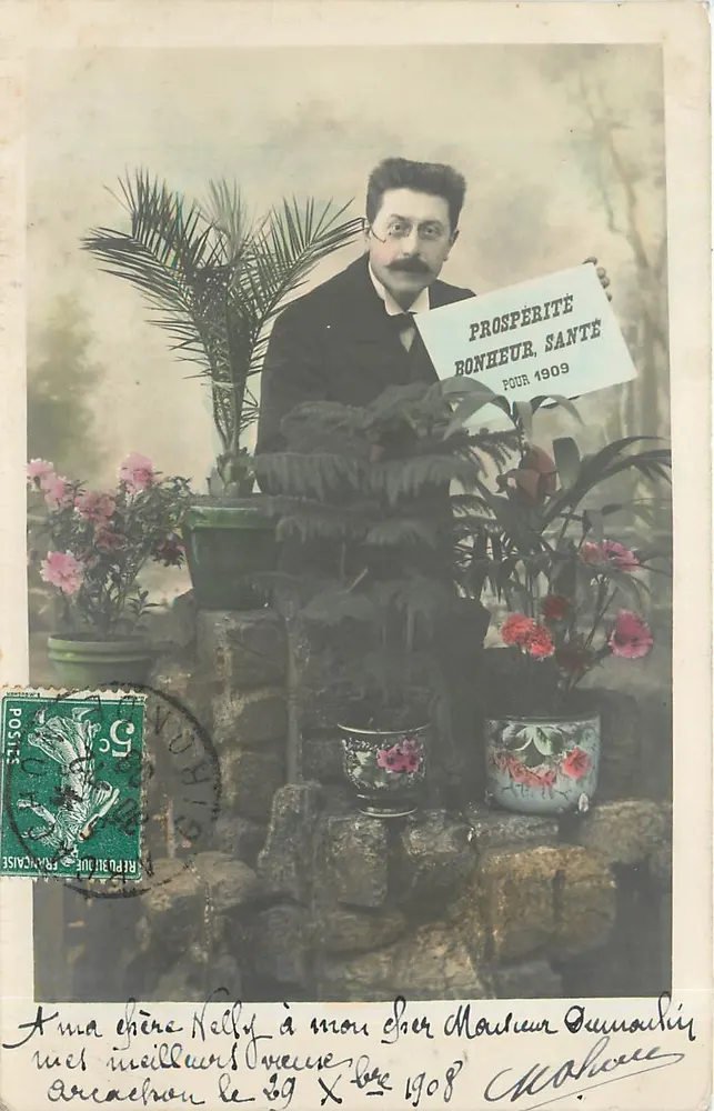 Homem com painel 'PROSPÉRITÉ BONHEUR SANTÉ POUR 1909' — editor R. Gauthierminot, Dampfug & Cie, Paris — número de série não visível - Frente