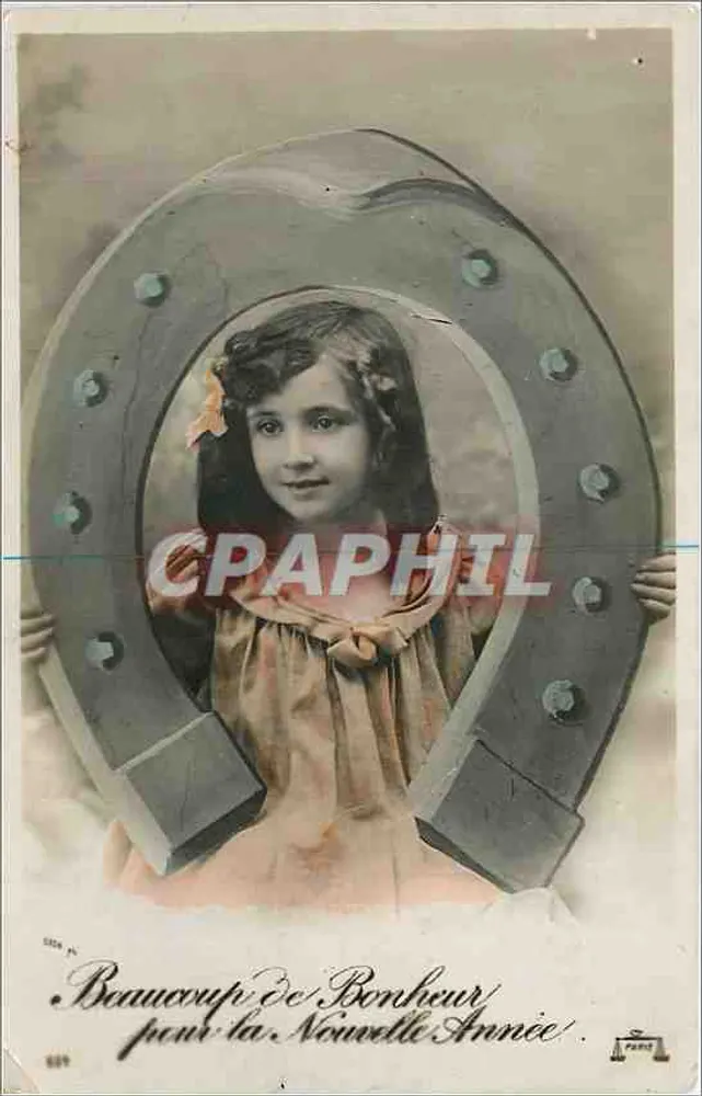 Menina em um ferro de cavalo — desejo de felicidade para o novo ano — Paris - Frente