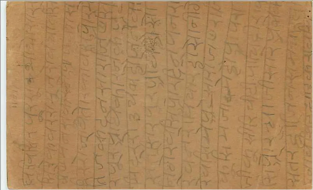 Carta postal indiana — texto em escrita tibetana — selo de 9 p. e carimbo 'SQUAT' datado 4 FÉV - Verso