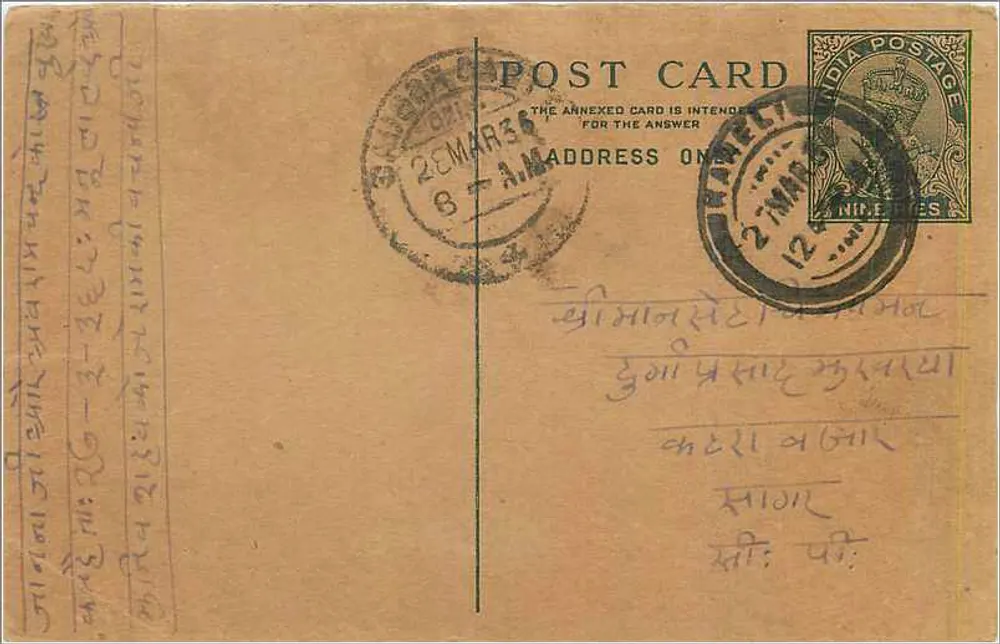 Carta postal indiana — texto em escrita tibetana — selo de 12 pence e carimbo de Delhi - Frente