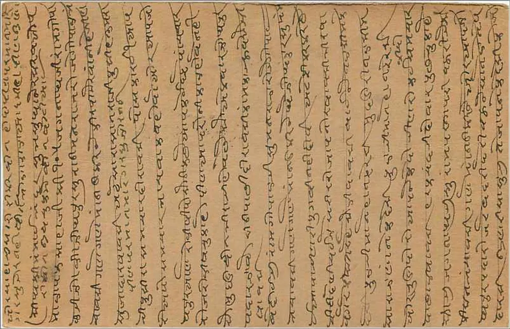 Carta postal indiana — escrita em escrita tibetana — carimbo de 9 pence e carimbo postal de Calcutta - Verso