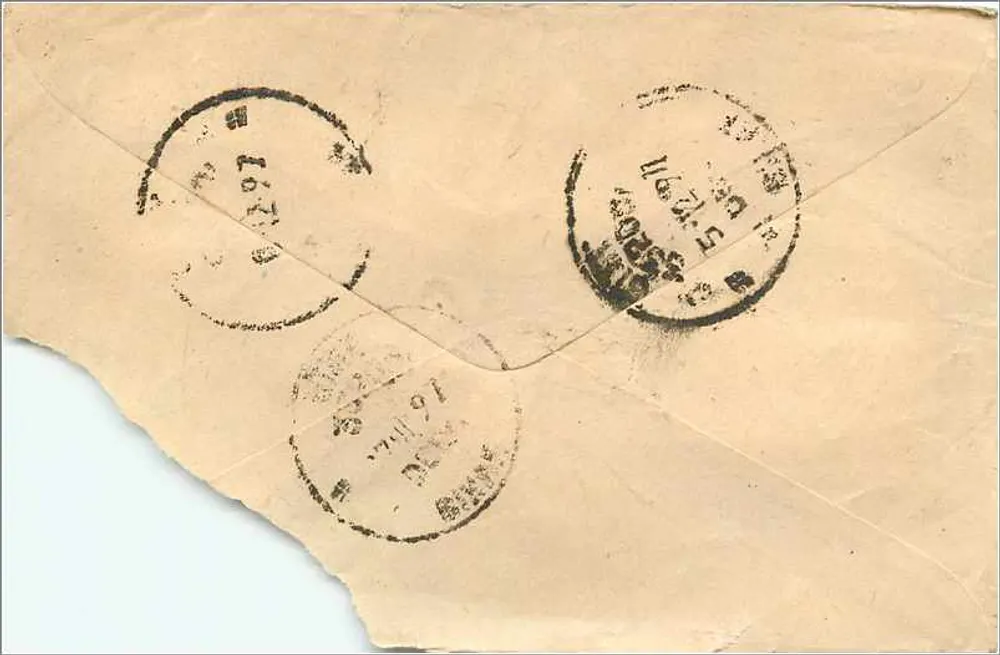 Carta postal indiana — texto manuscrito em devanagari — selos e carimbos visíveis - Verso