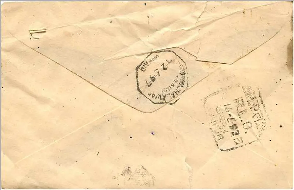 Carta postal indiana — texto em escrita devanagari — selo de 100 p. — carimbo de Shahjahanpur - Verso
