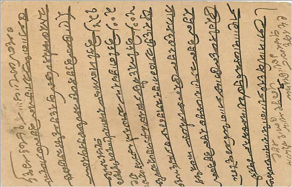 Carta postal enviada de Delhi para Jodhpur — texto em escrita devanagari — selo e carimbo da Índia - Verso