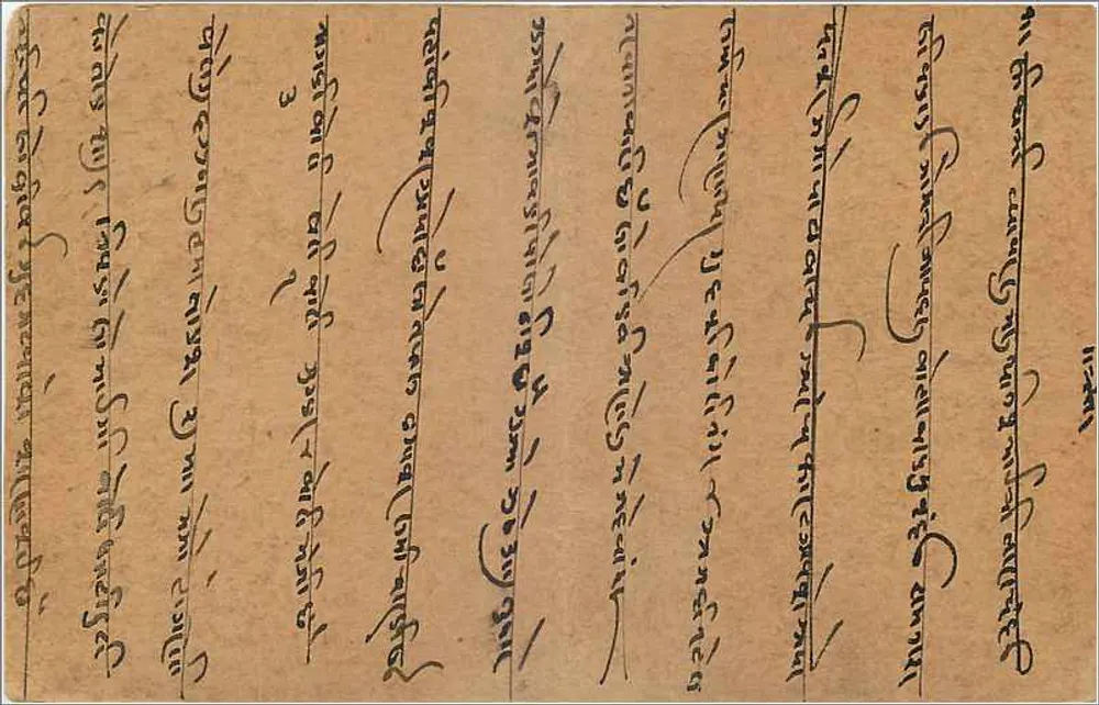 Carta postal indiana — texto em escrita tibetana — selo de 9 pence e carimbo de Gwalior - Verso