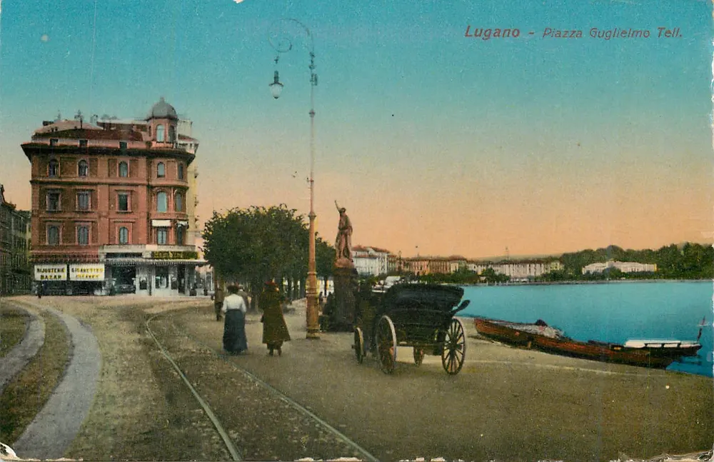 Lugano - Piazza Guglielmo Tell — widok na jezioro z statuą i tramwajem — wydawca DPA, nr 1098 - Awers