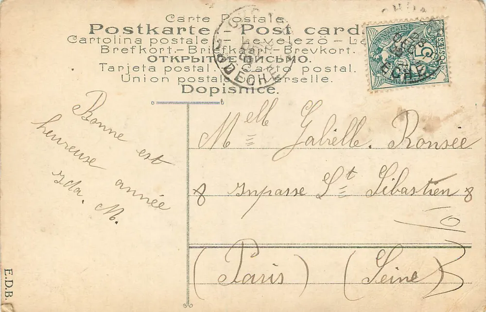 Femme en robe ornée — portrait studio — éditeur E.D.B. n° 323 - Verso