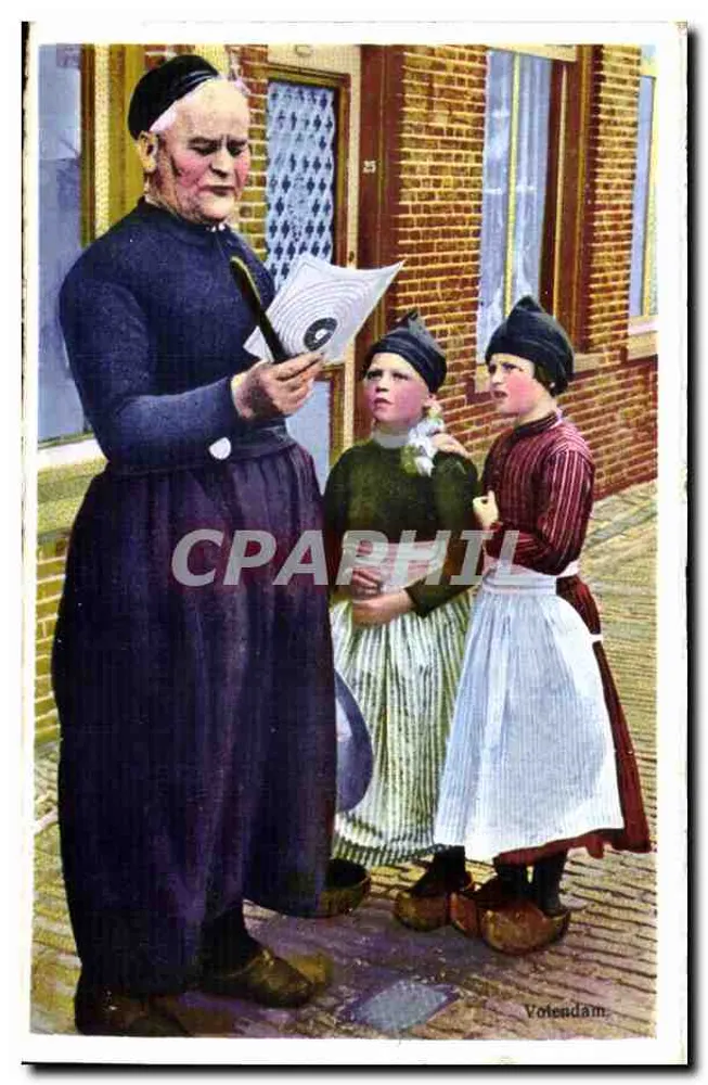 Votendam — Eine ältere Frau unterrichtet zwei junge Mädchen — Photochromie Ulitroering N. & O. Nr. 508/1 - Vorderseite