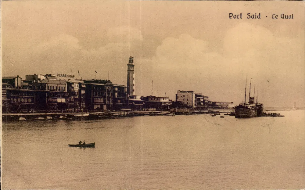 Port Said - Der Kai — Ansicht des Hafens mit Leuchtturm und Boot — The Cairo Postcard Trust, Serie 208 - Vorderseite