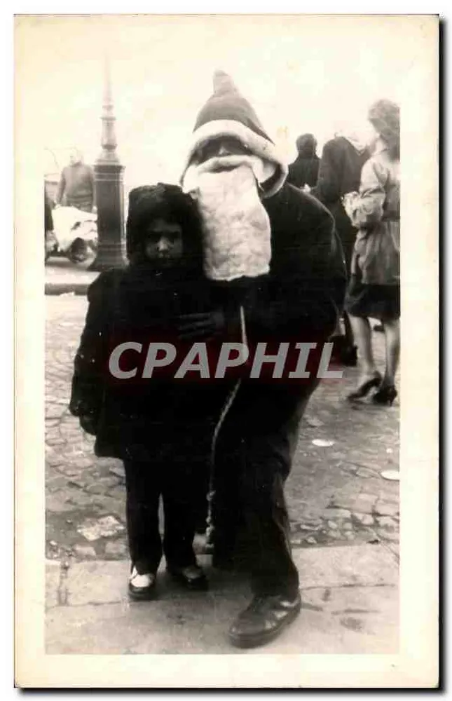 Santa Claus e criança — cena de rua — sem editor ou número visível - Frente