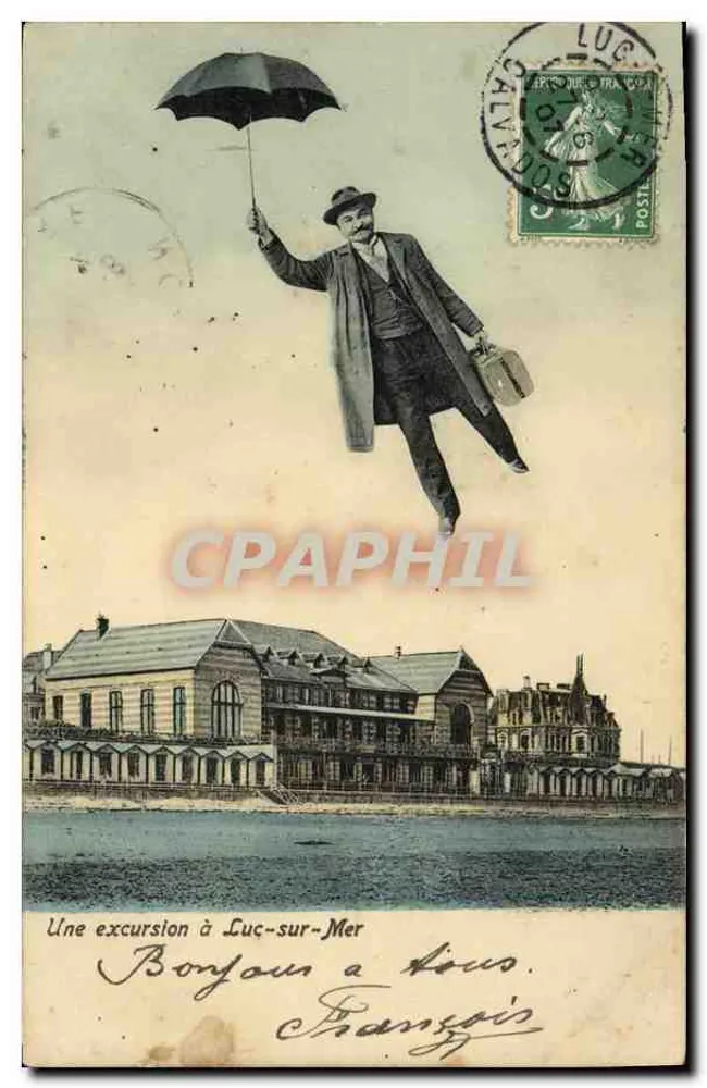 Um homem com guarda-chuva flutuando — Uma excursão a Luc-sur-Mer — editor não visível - Frente