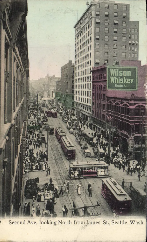 Second Ave. looking North from James St., Seattle, Wash. — städtische Ansicht mit Straßenbahnen und Werbetafel Wilson Whiskey — Verlag Rhodes & Co. Nr. 2 - Vorderseite